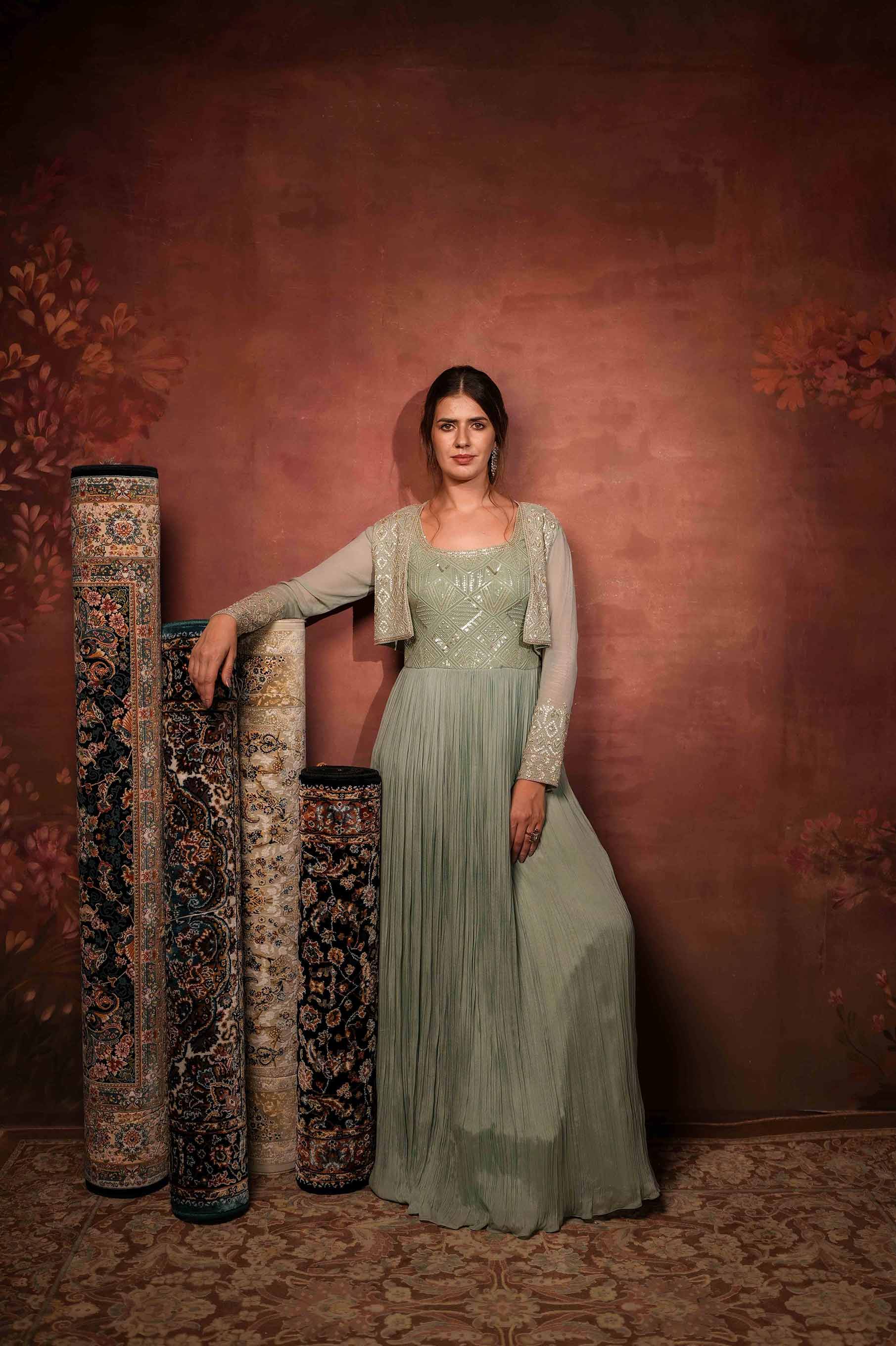 Dull mint gathered gown with short shrug.