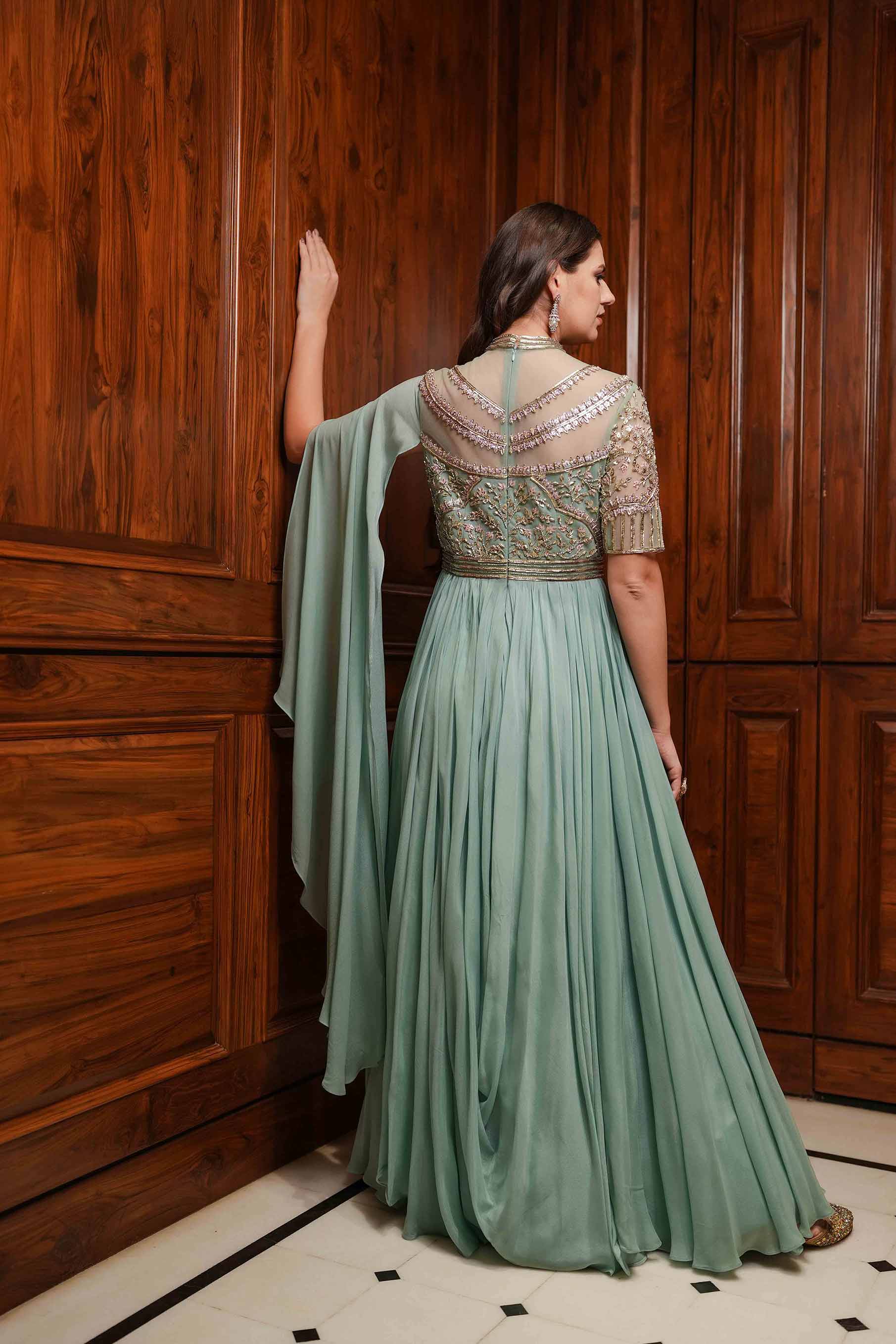 Dusty mint high neck embroidered cowl draped gown.