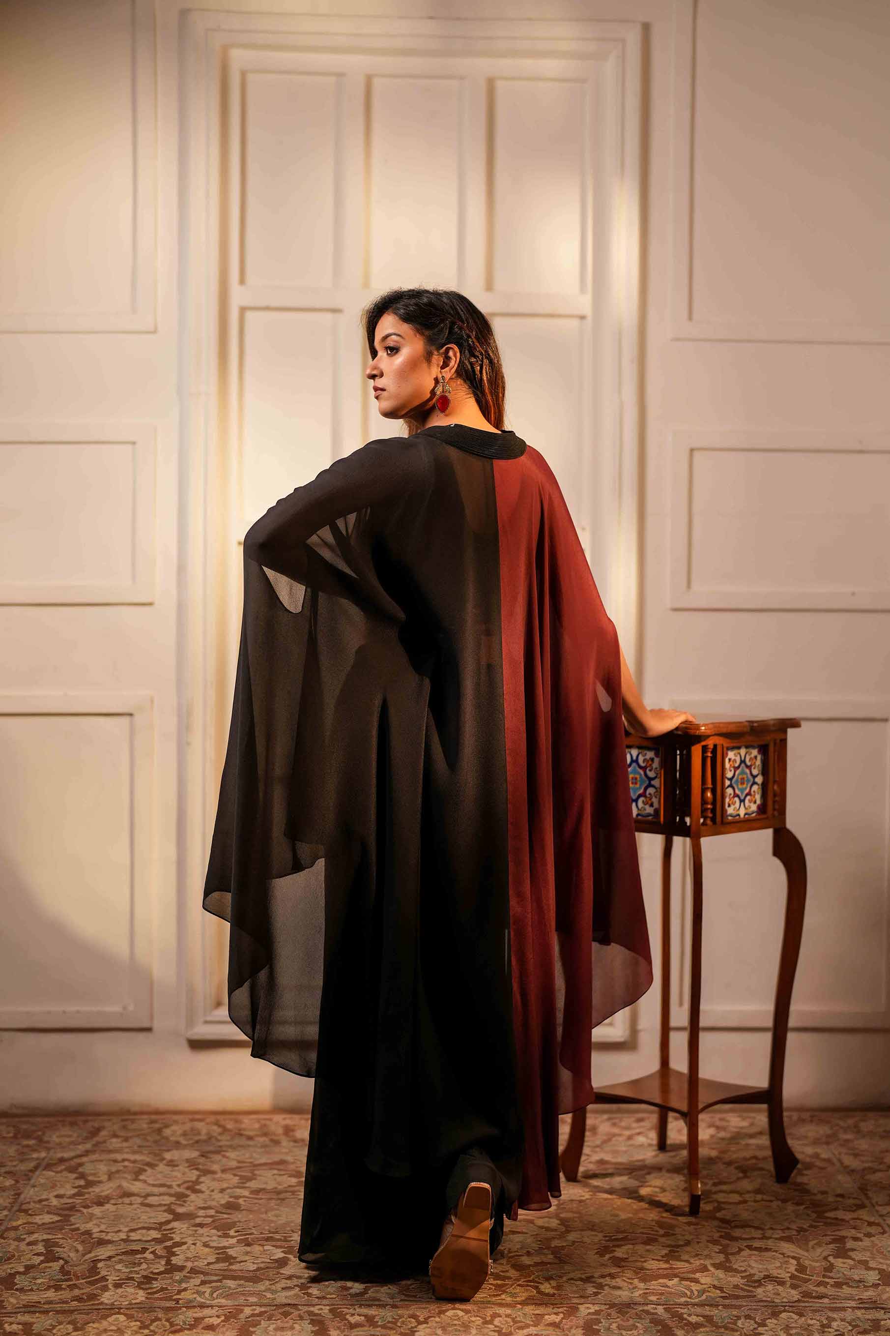 Wine and black crop top with flared palazzo and asymmetric hem poncho style tunic.