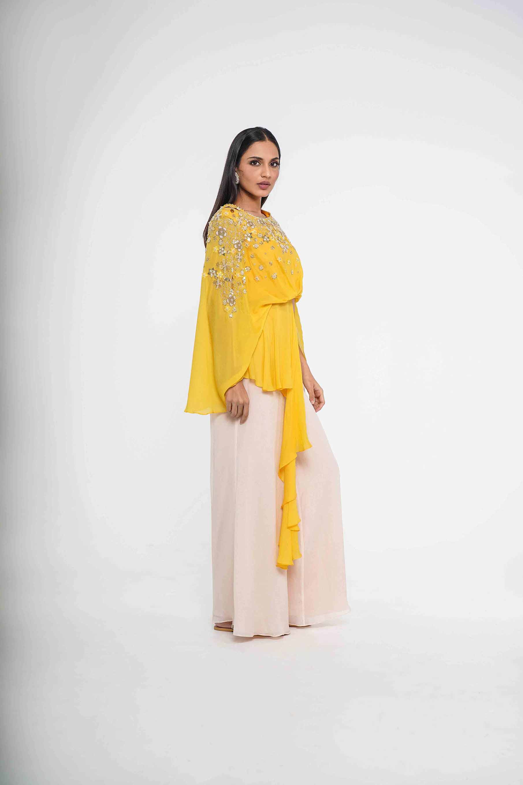 Mustard cape crop top with asymmetric drape and palazzo set.