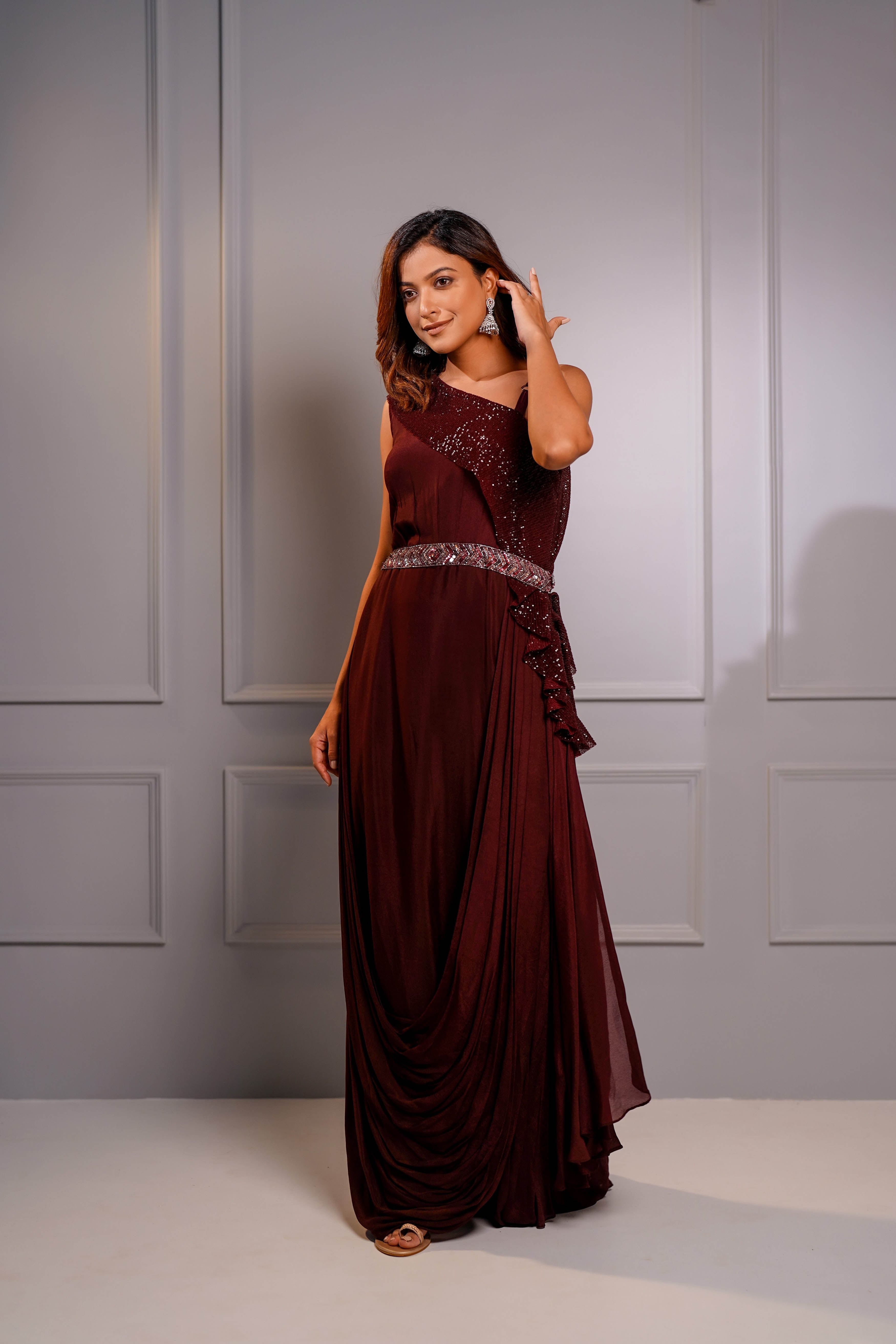 Wine draped one shoulder gown.
