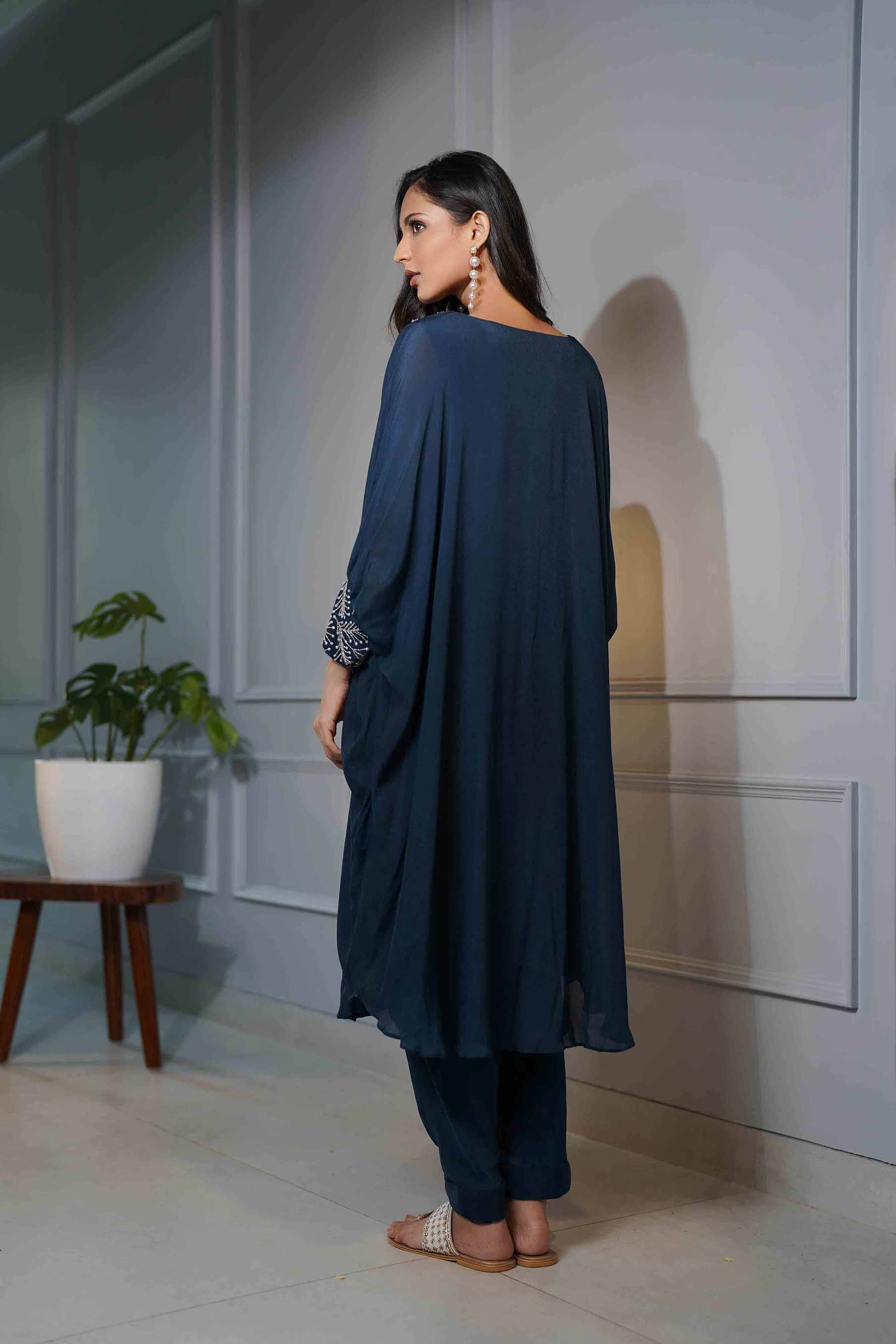 Teal blue flared poncho style tunic with dhoti pants.