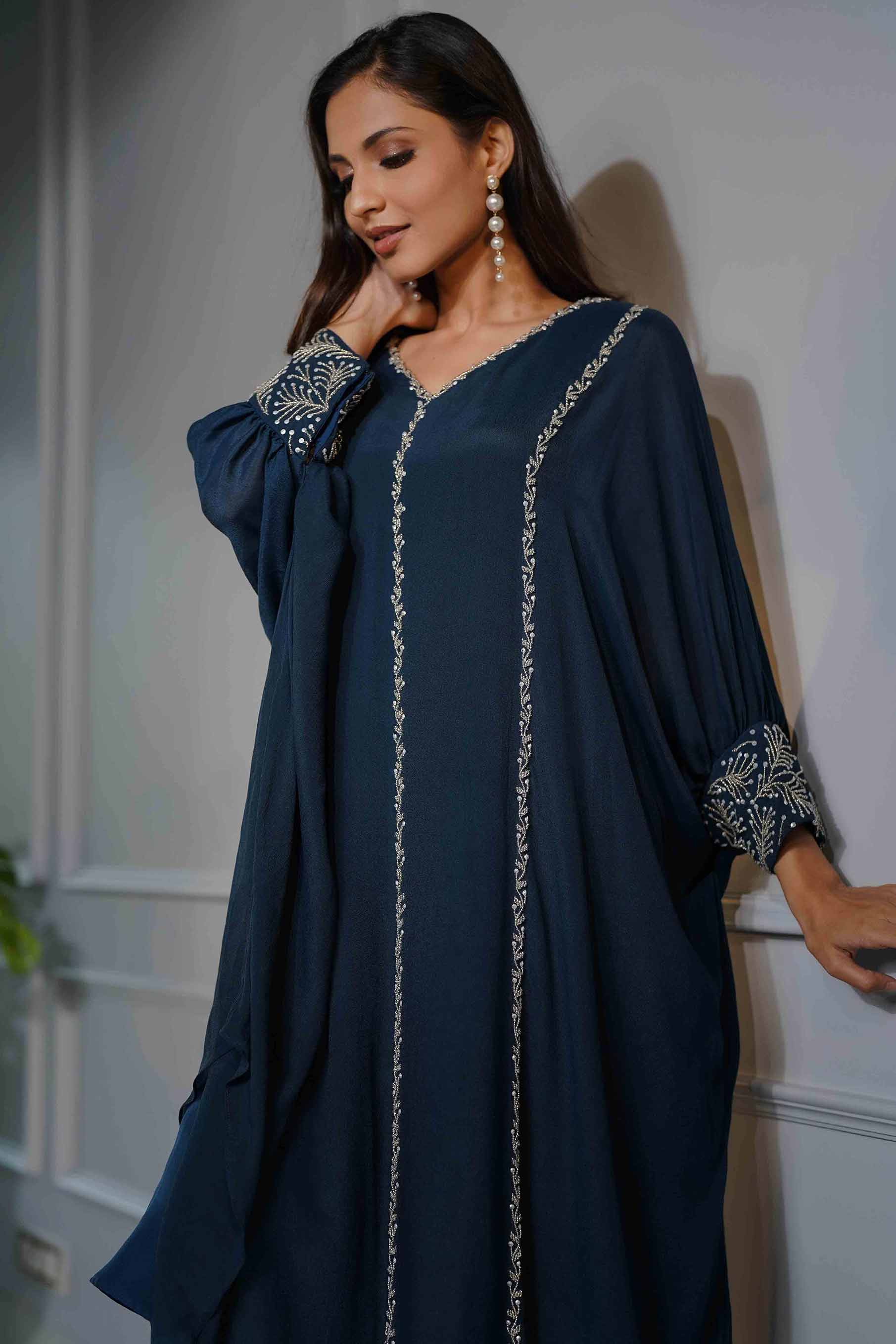 Teal blue flared poncho style tunic with dhoti pants.