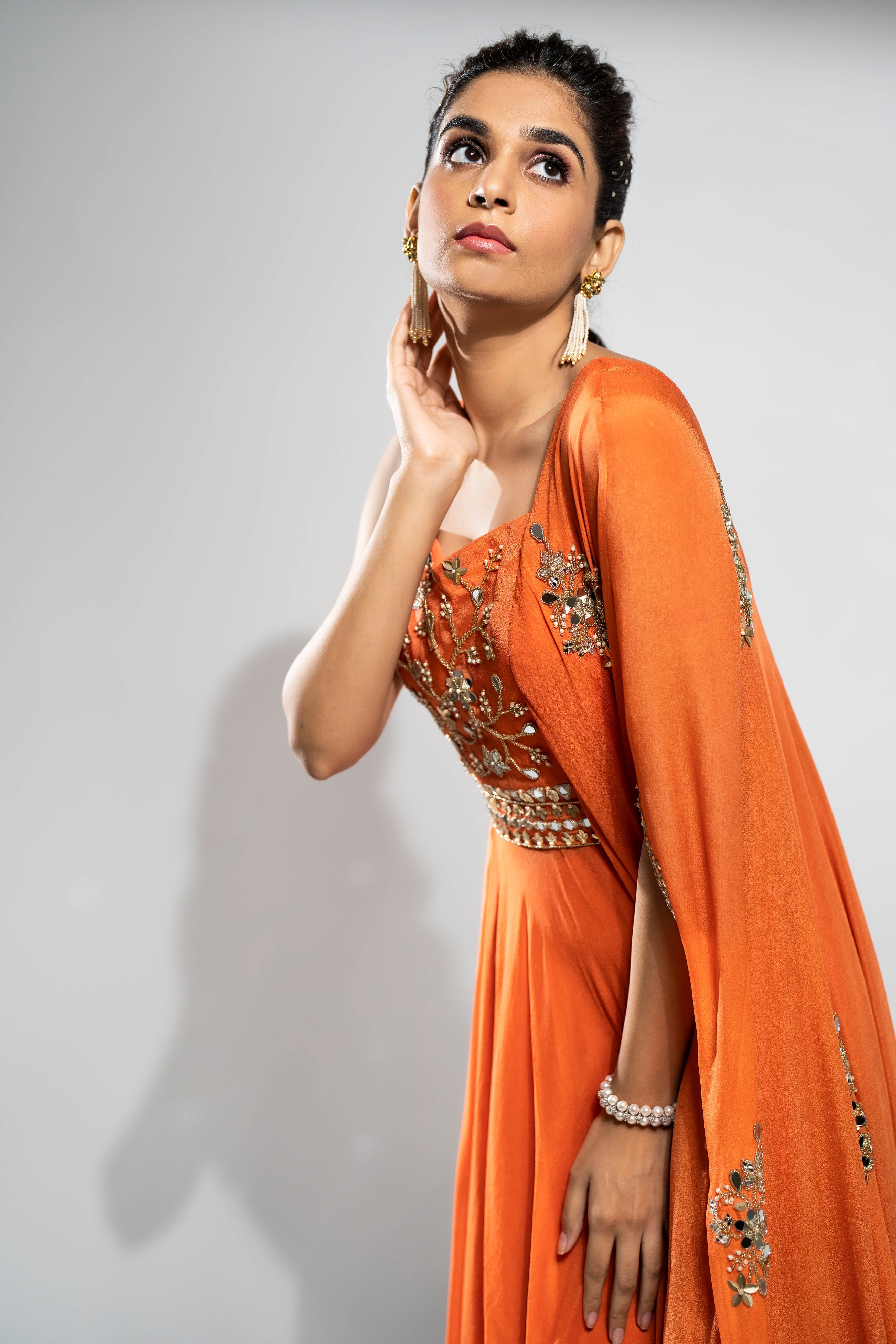 Rust fit and flare tunic with one side drape with palazzo set.