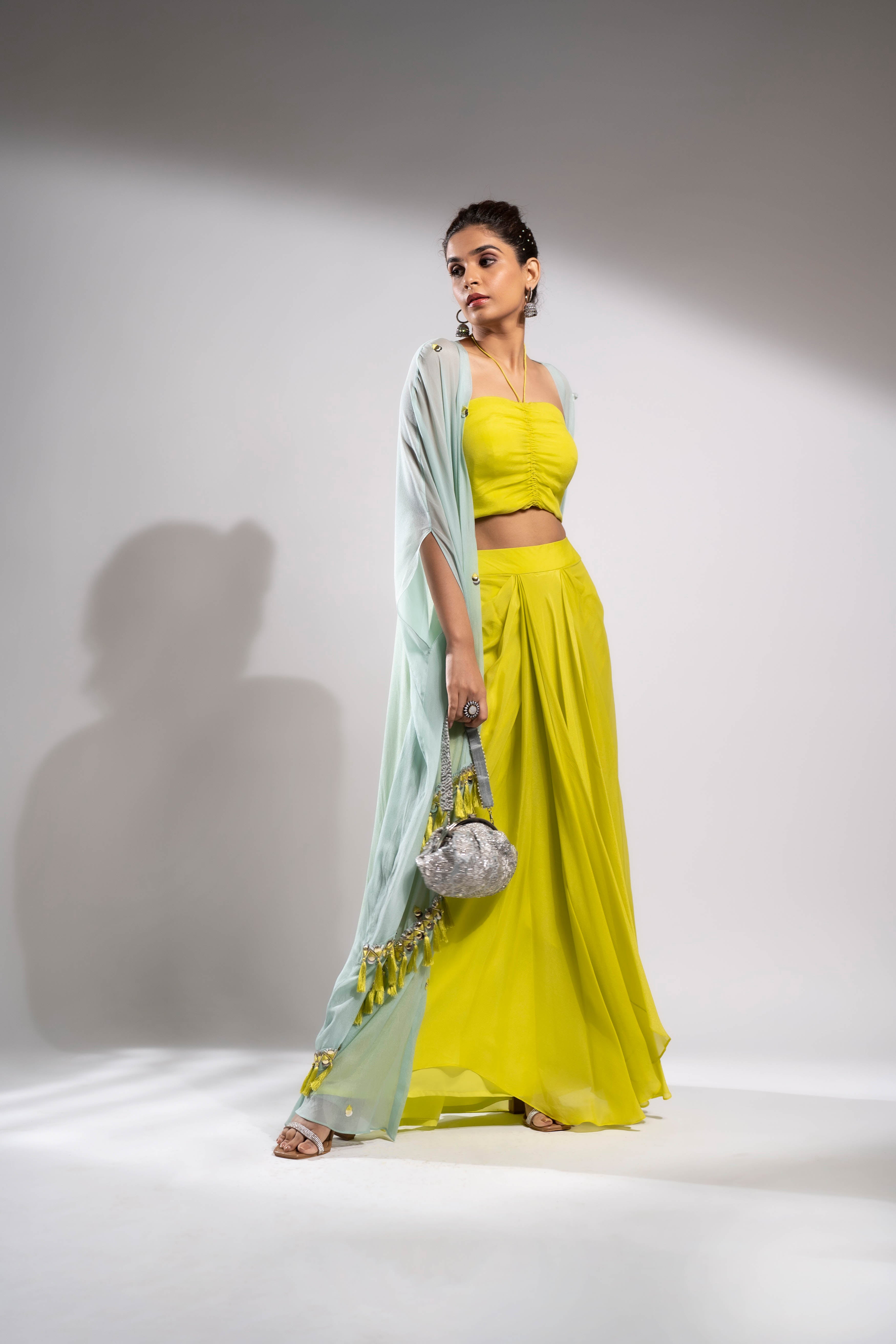 Dusty aqua and parrot green cape with tube crop top and draped skirt set.