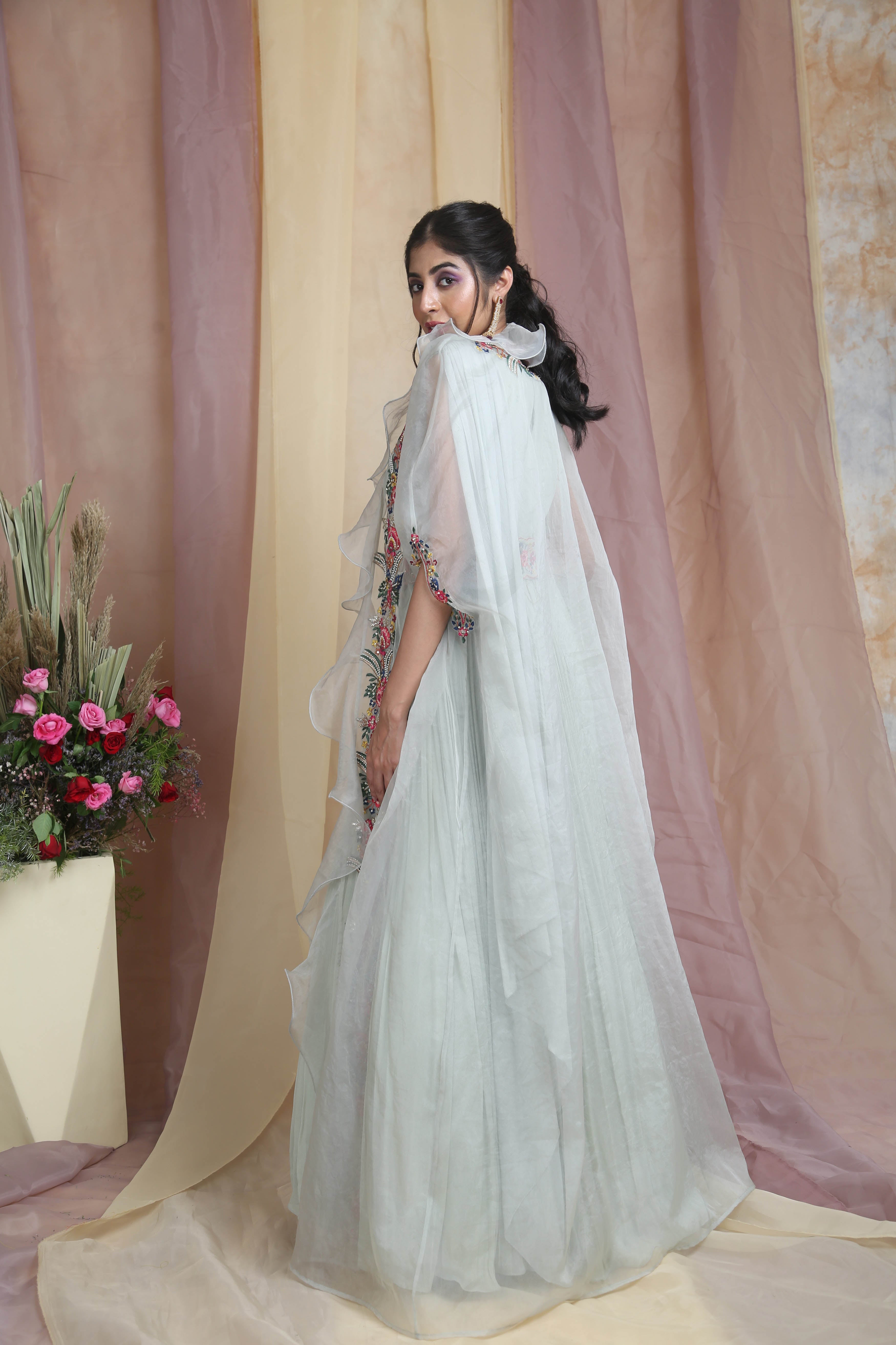 MINT GREEN DRAPE GOWN WITH EMBROIDERED RUFFLE CAPE